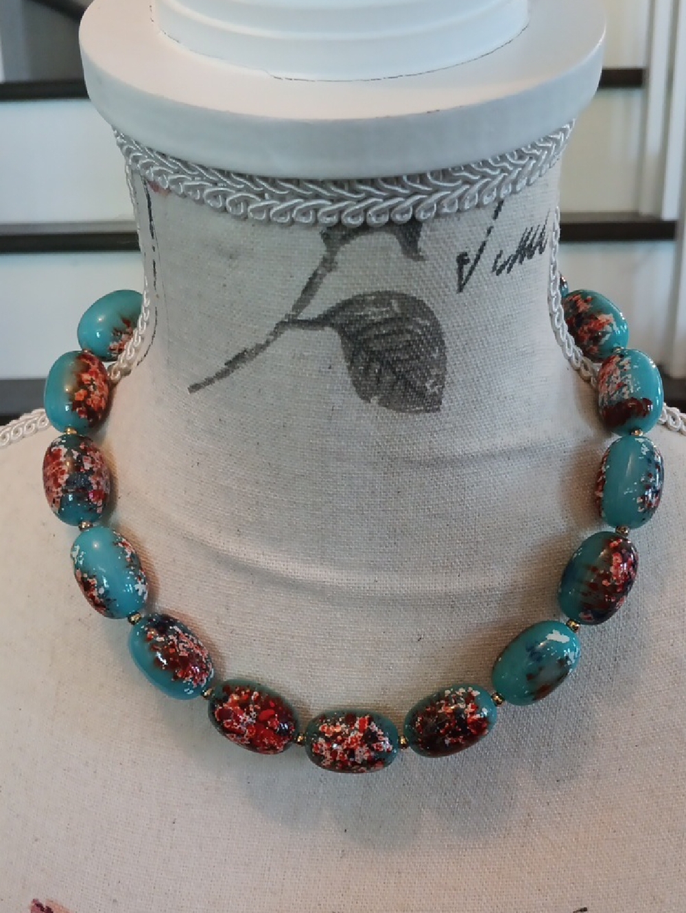 # Vintage Blue Oval Bead Necklace with Floral Design